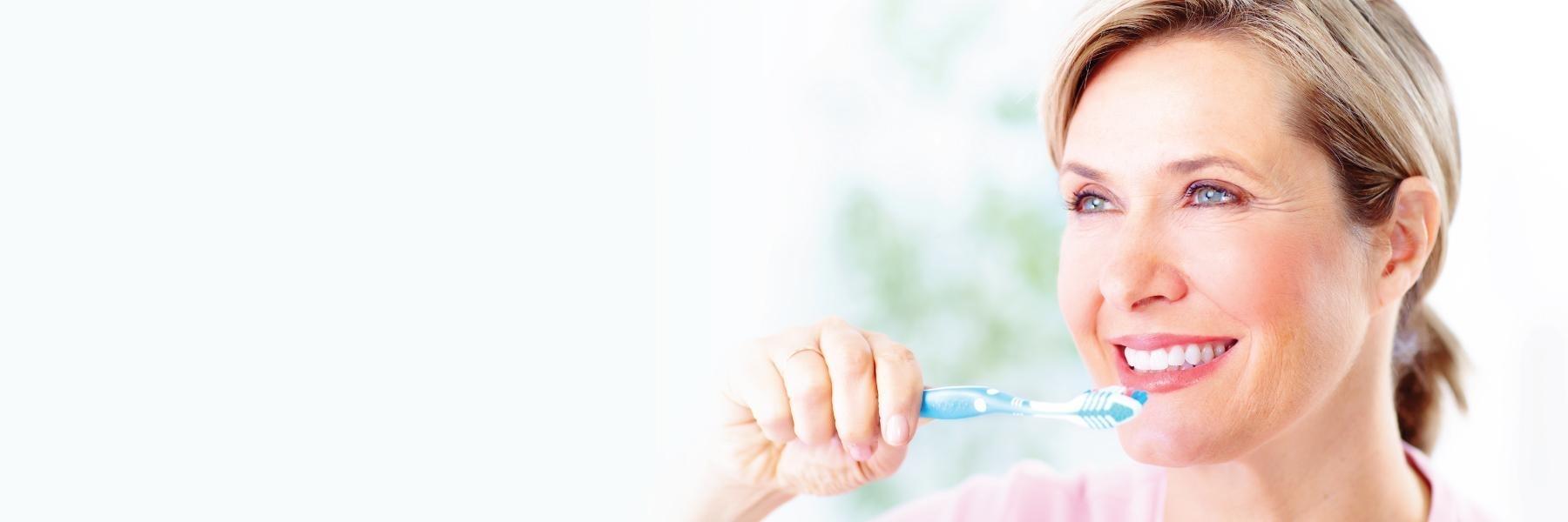 woman brushing her teeth in mount pleasant sc