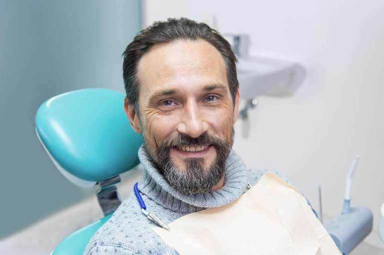 A happy male patient after a Precisely Placed Dental Implants in Mount Pleasant, SC