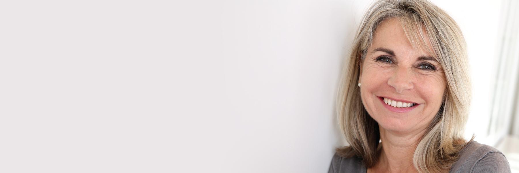 woman with dental implants in charleston