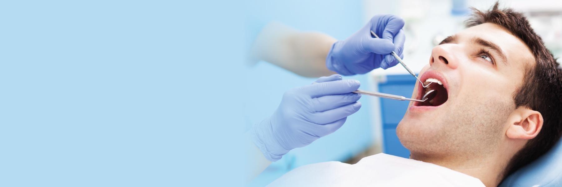 man during emergency dental exam in mount pleasant